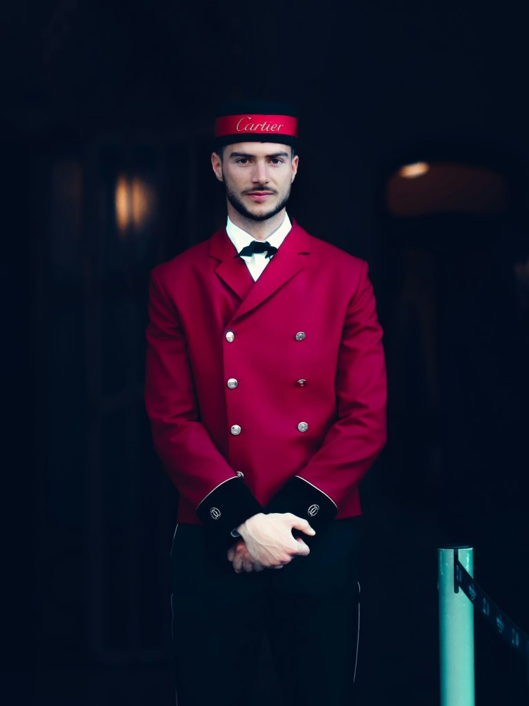 Hotel doorman standing at an entrance