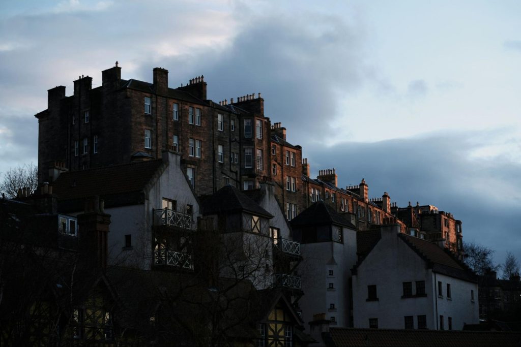 Residential Edinburgh hillside buildings at dusk
