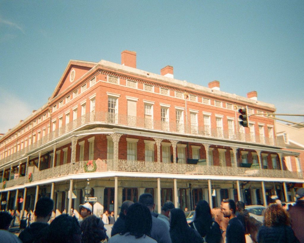 Historic New Orleans corner building in a busy district
