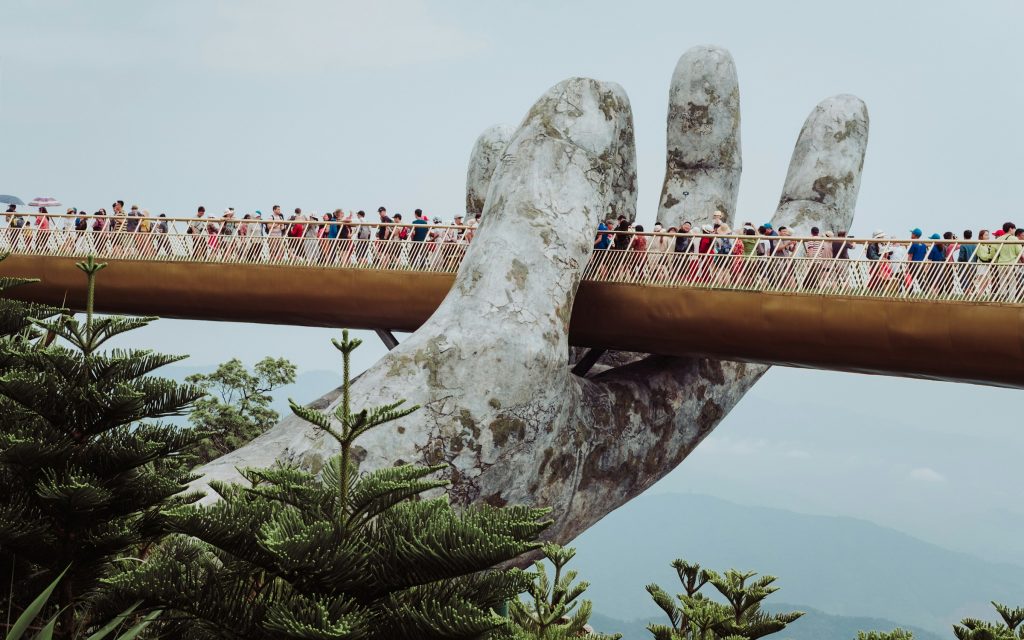 Golden Bridge (Cau Vang) held by giant stone hands at Ba Na Hills, Da Nang, Vietnam