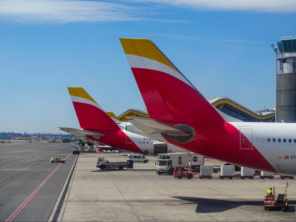 Commercial airplanes parked at Spanish airport terminal