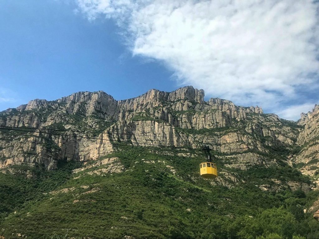 Cable car crossing rocky Spanish mountains
