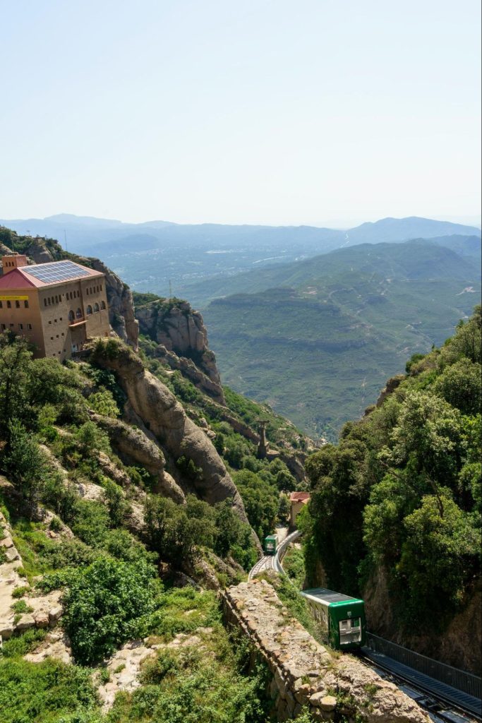 Funicular railway climbing steep mountain cliffs in Spain