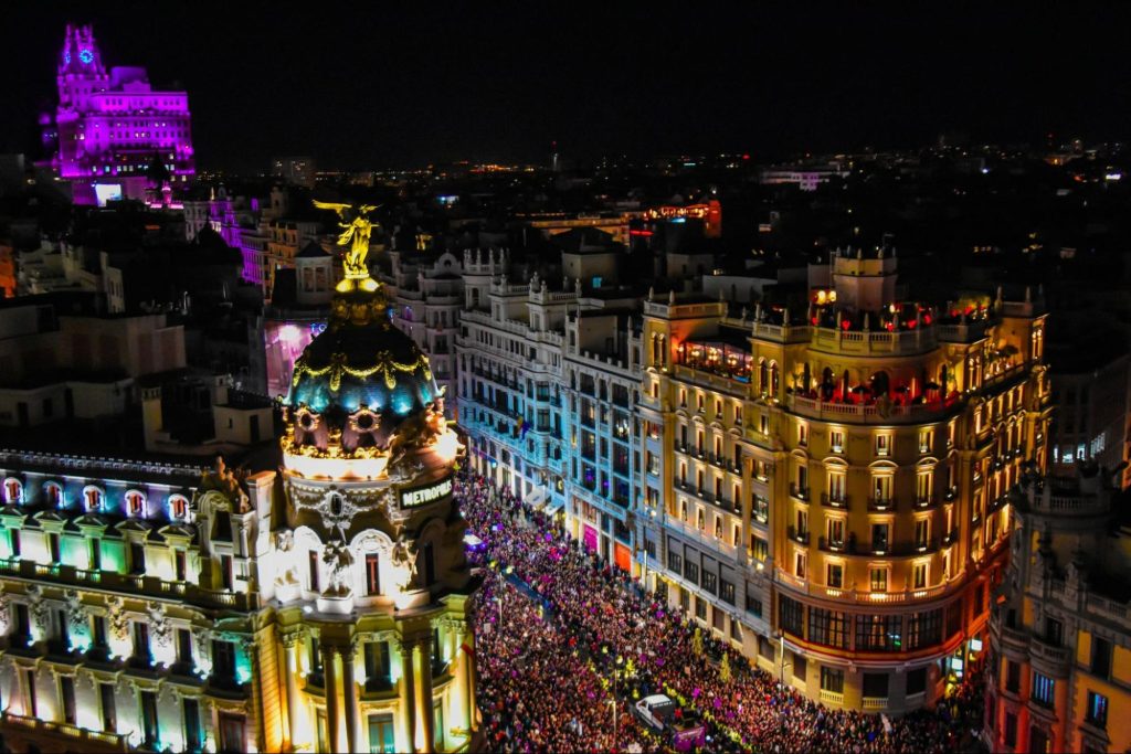 Night view of Madrid Gran Via crowded with people