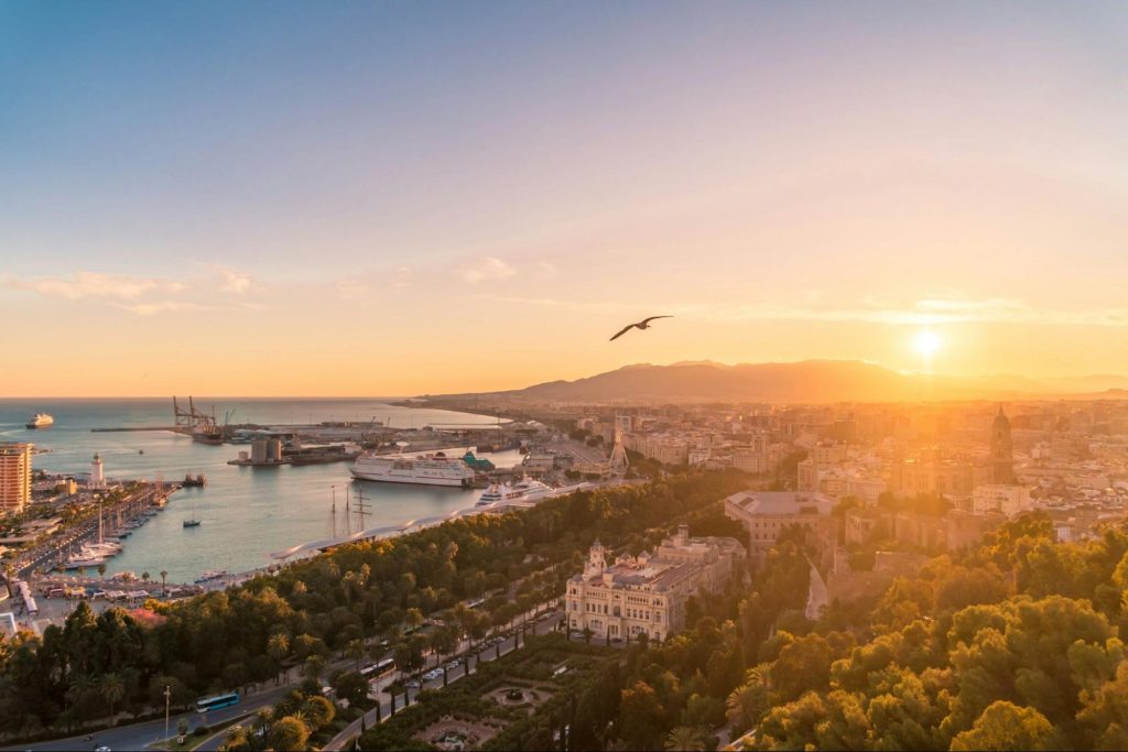 Sunset view over Malaga port and city skyline