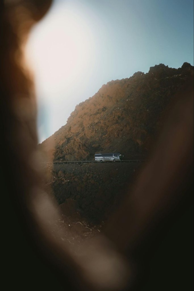 Coach bus driving along a mountain road