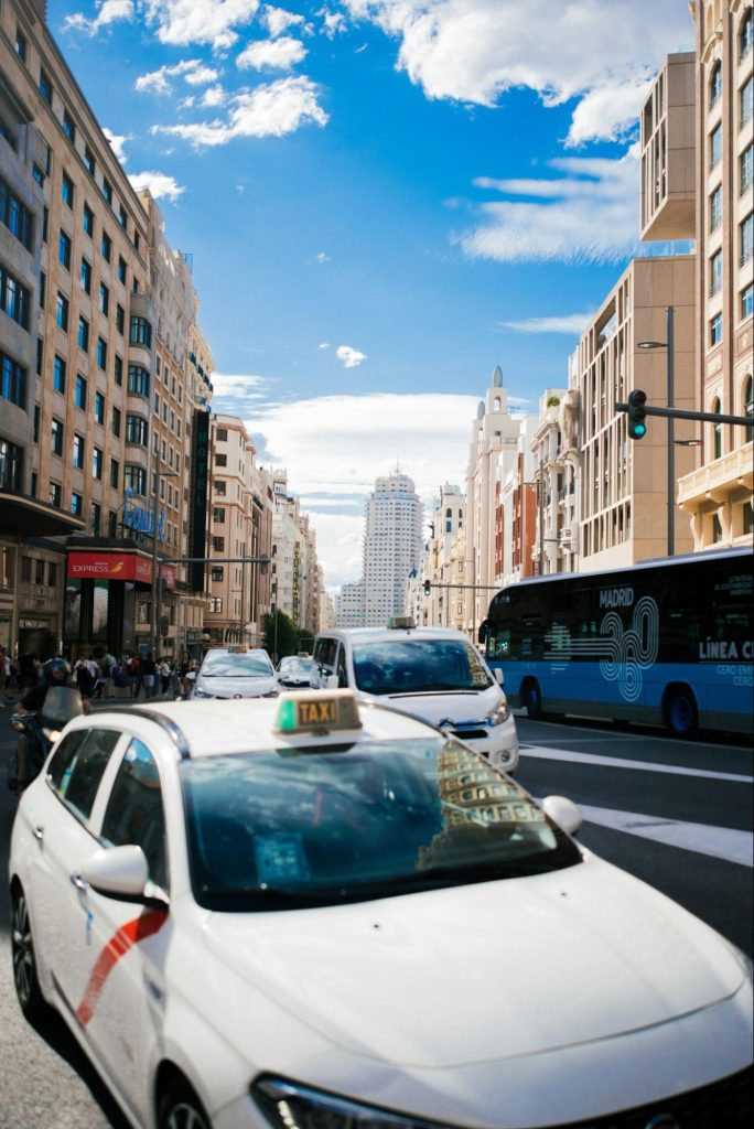 Taxi and traffic on a busy Madrid street