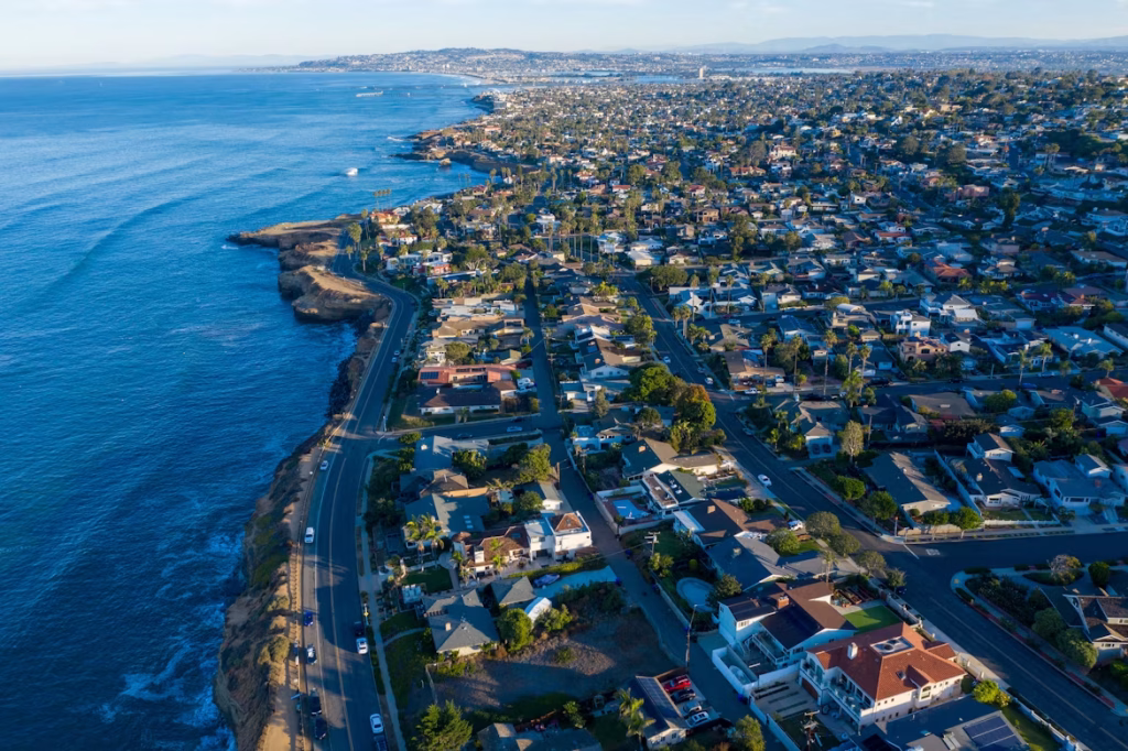 Aerial view of the San Diego coastline with residential neighborhood and ocean
