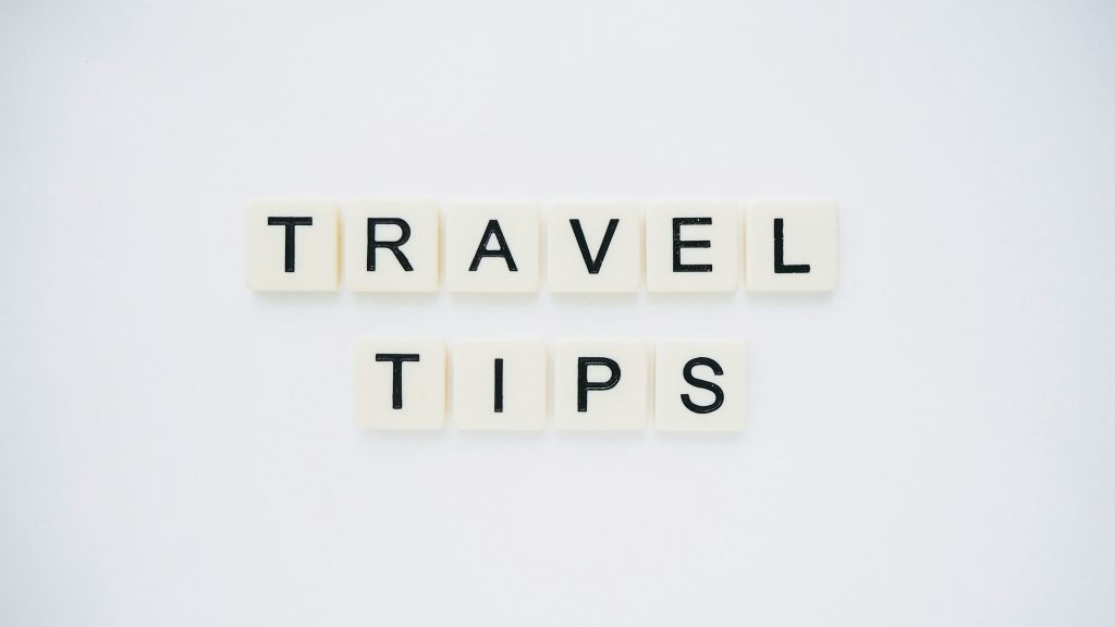 “Travel tips” letter tiles on a white background for practical Vietnam temple visit advice